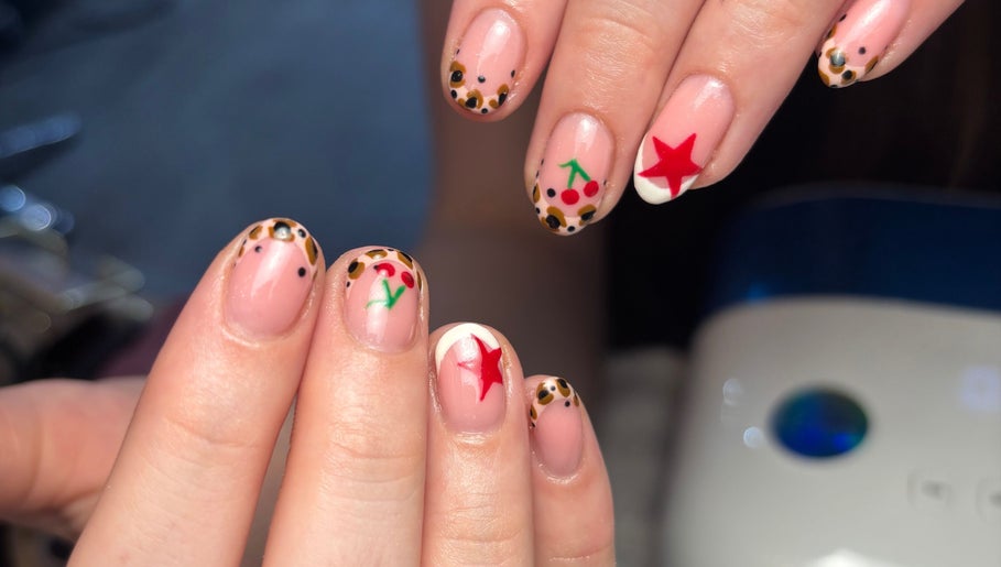Creative nail art featuring stars and cherries at Beauty By Meg, Bridlington, England, GB.