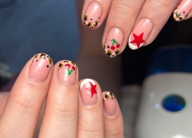 Creative nail art featuring stars and cherries at Beauty By Meg, Bridlington, England, GB.