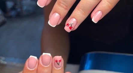 Close-up of cherry nail art at Beauty By Meg, Bridlington, England, GB, showcasing elegant French tips.