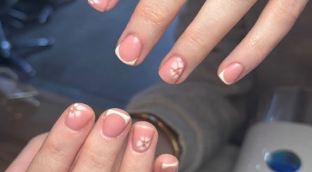Elegant nail art with pink polish and flower design at Beauty By Meg, Bridlington, England, GB.