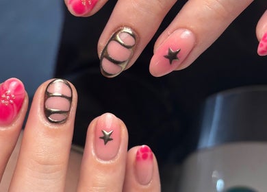 Intricate nail designs from Beauty By Meg, Bridlington, England, GB showcasing artistic patterns and stars.