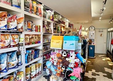 Shelves stocked with pet food and toys at PawsNatural Pet Store, Toronto, Ontario, CA.