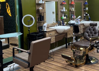 Elegant interior of Stevostyle Hair Beauty in London, England, GB featuring chic salon chairs and modern decor.