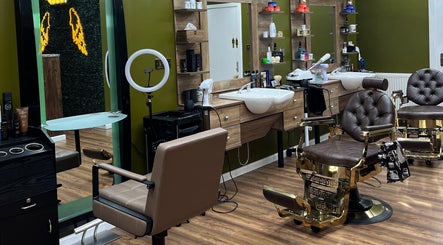 Elegant interior of Stevostyle Hair Beauty in London, England, GB featuring chic salon chairs and modern decor.