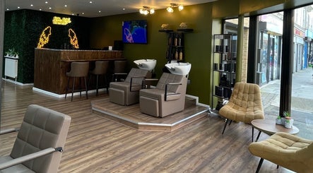 Modern salon interior of Stevostyle Hair Beauty in London, England, GB with stylish chairs and washing stations.