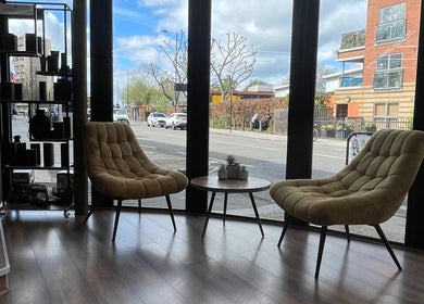 Elegant seating area with plush chairs at Stevostyle Hair Beauty, London, England, GB, offering street views.