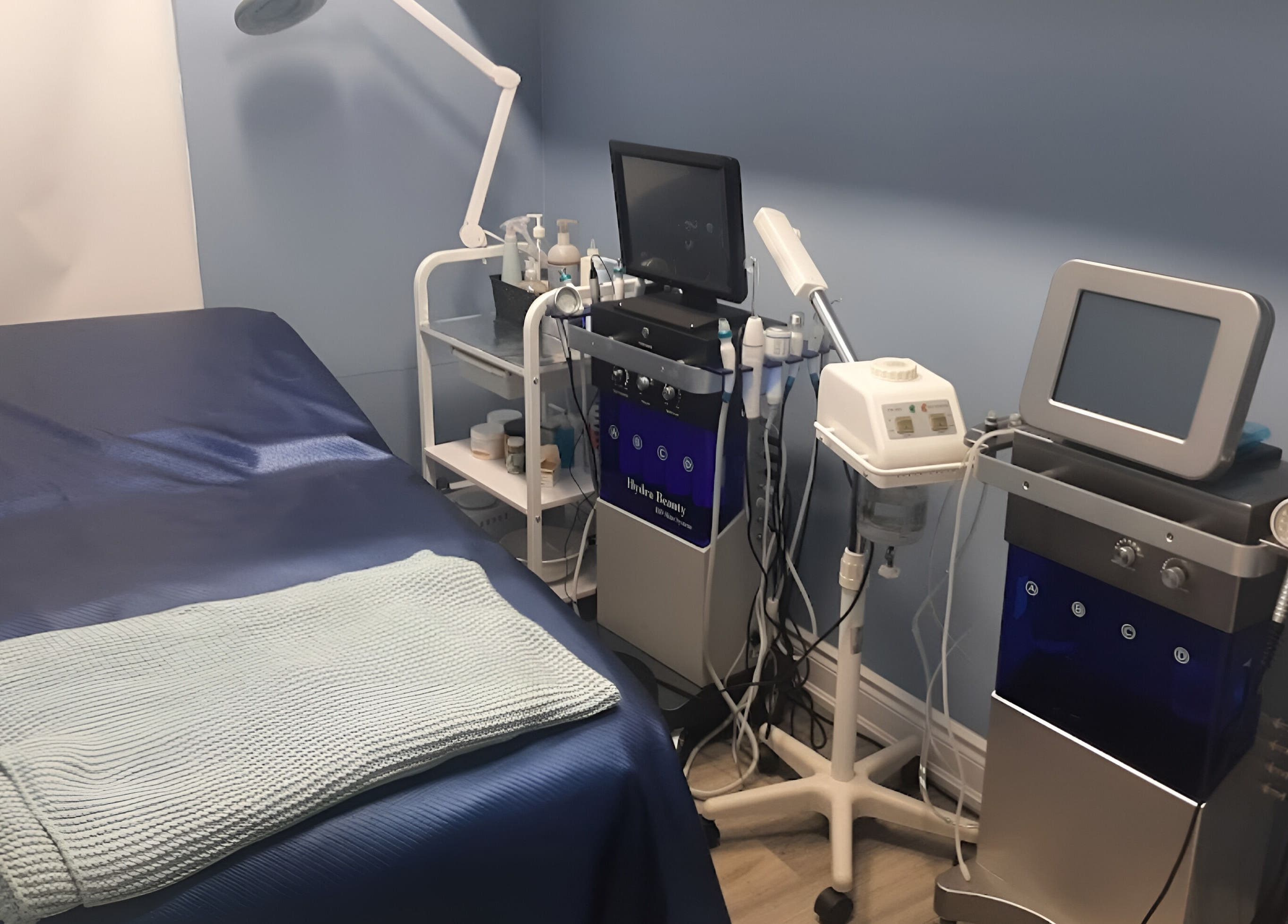 Advanced facial treatment room at Luxe Salon & Spa, Brampton, Ontario, CA, showcasing modern hydra beauty equipment.