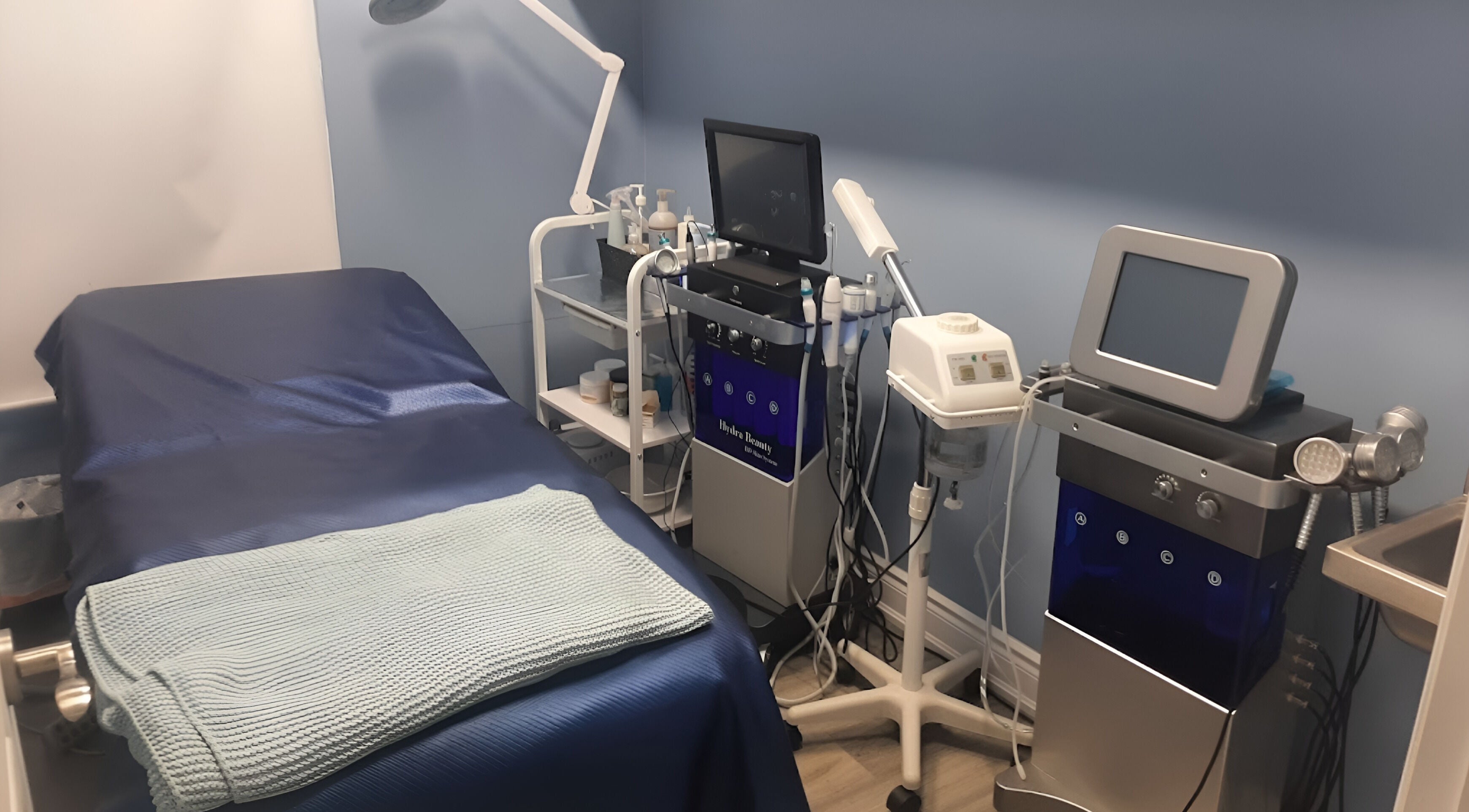 Advanced facial treatment room at Luxe Salon & Spa, Brampton, Ontario, CA, showcasing modern hydra beauty equipment.