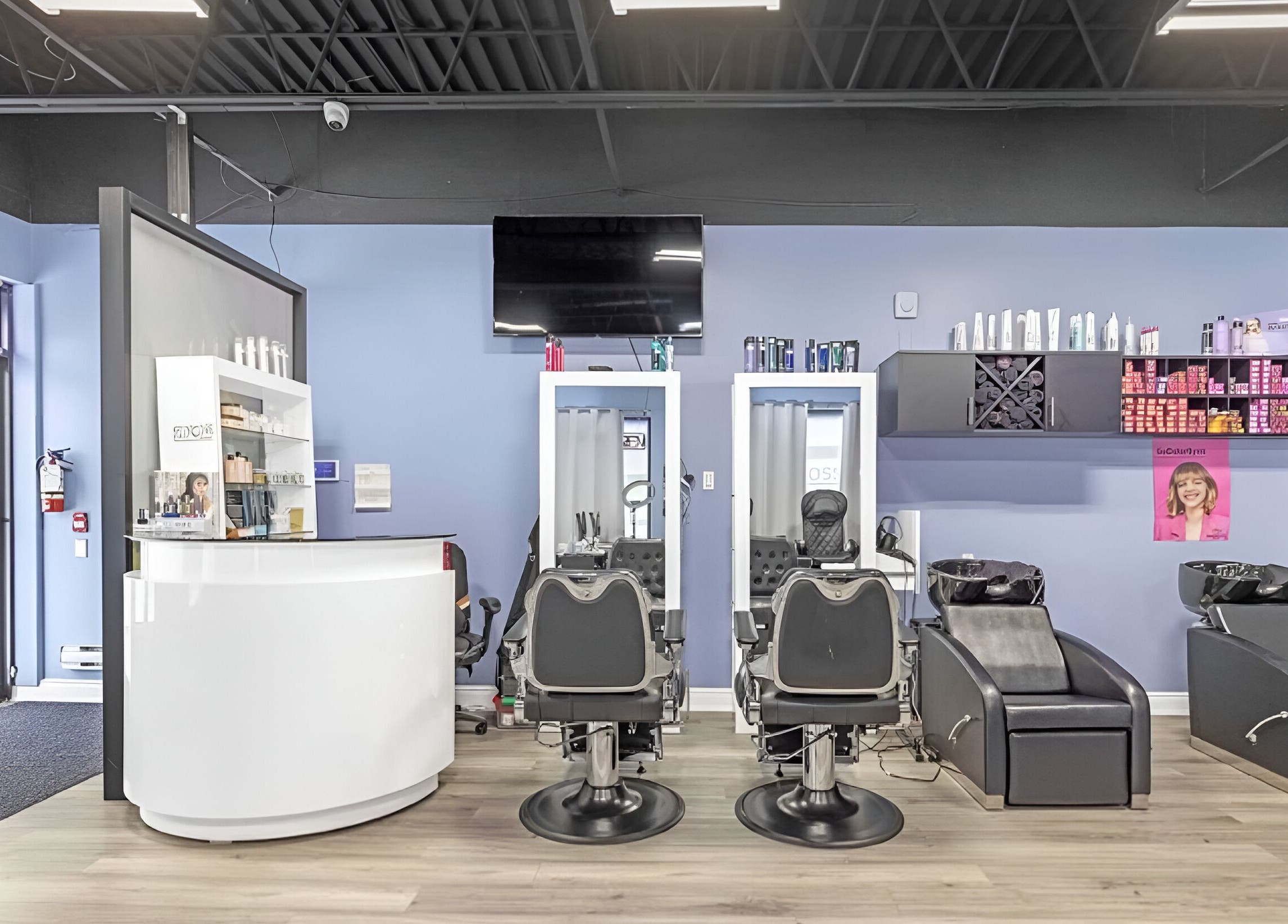 Interior of Luxe Salon & Spa in Brampton, Ontario, CA showcasing modern salon chairs and haircare products.