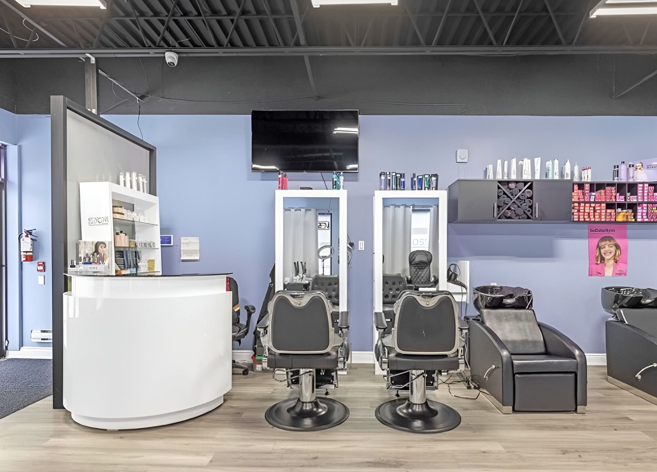 Interior of Luxe Salon & Spa in Brampton, Ontario, CA showcasing modern salon chairs and haircare products.