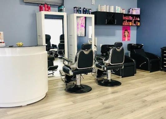 Modern styling area at Luxe Salon & Spa in Brampton, Ontario, CA showcasing sleek salon chairs and mirrors.