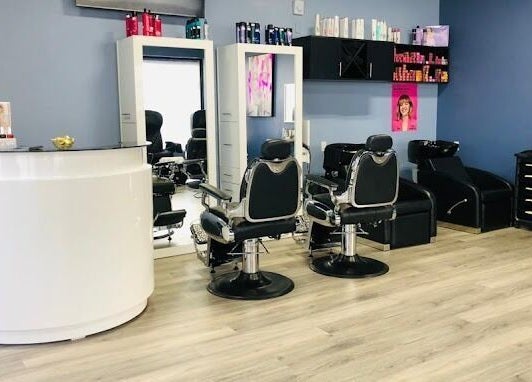 Modern styling area at Luxe Salon & Spa in Brampton, Ontario, CA showcasing sleek salon chairs and mirrors.