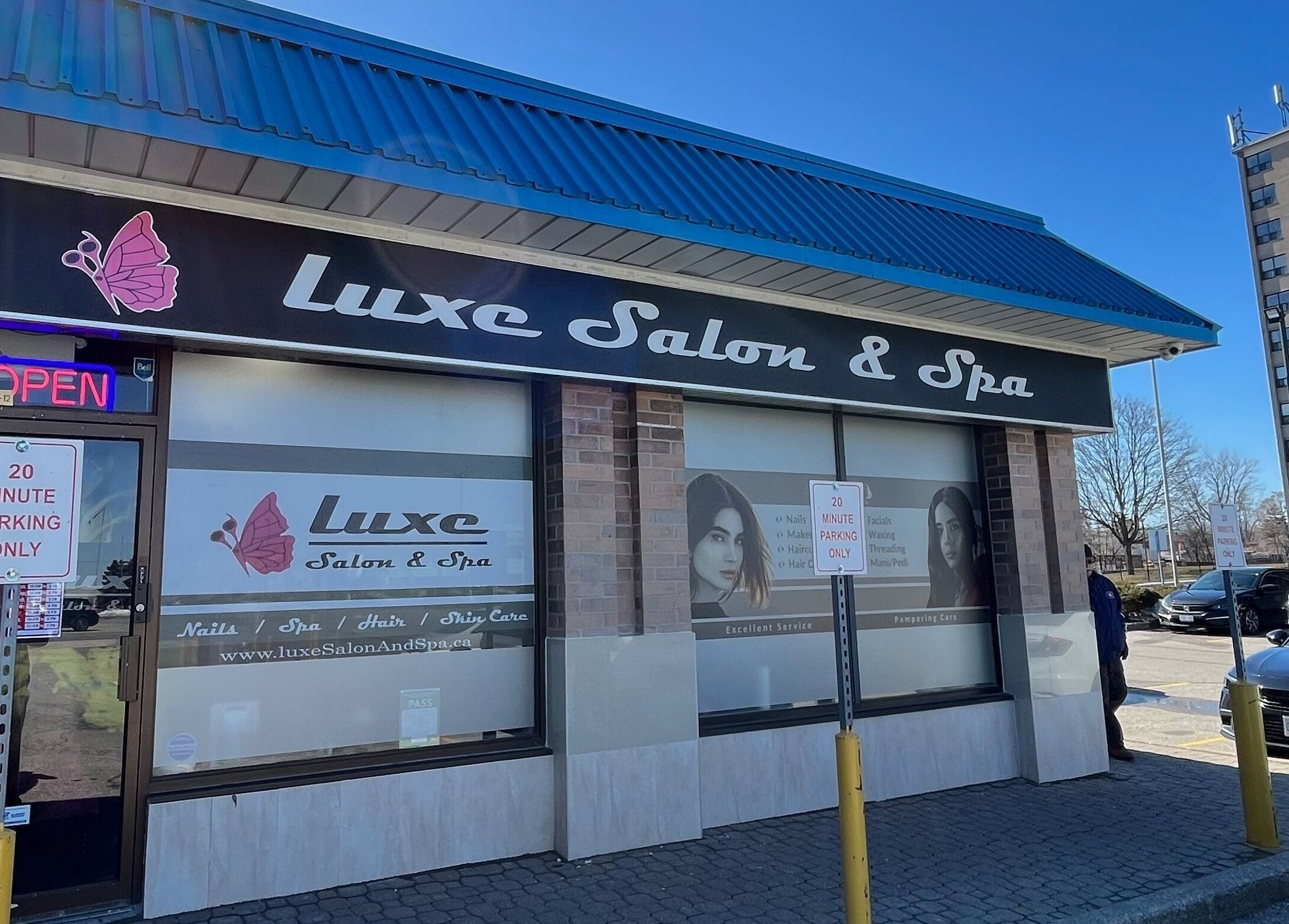 Front view of Luxe Salon & Spa located in Brampton, Ontario, CA with 'Open' sign visible.
