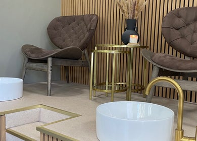Worth Beauty's luxe pedicure chairs in Cleckheaton, England, GB with stylish decor and gold accents.