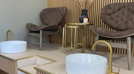 Worth Beauty's luxe pedicure chairs in Cleckheaton, England, GB with stylish decor and gold accents.