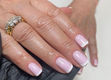 French manicure at Worth Beauty, Cleckheaton, England, GB, showcasing glossy pink nails with white tips.