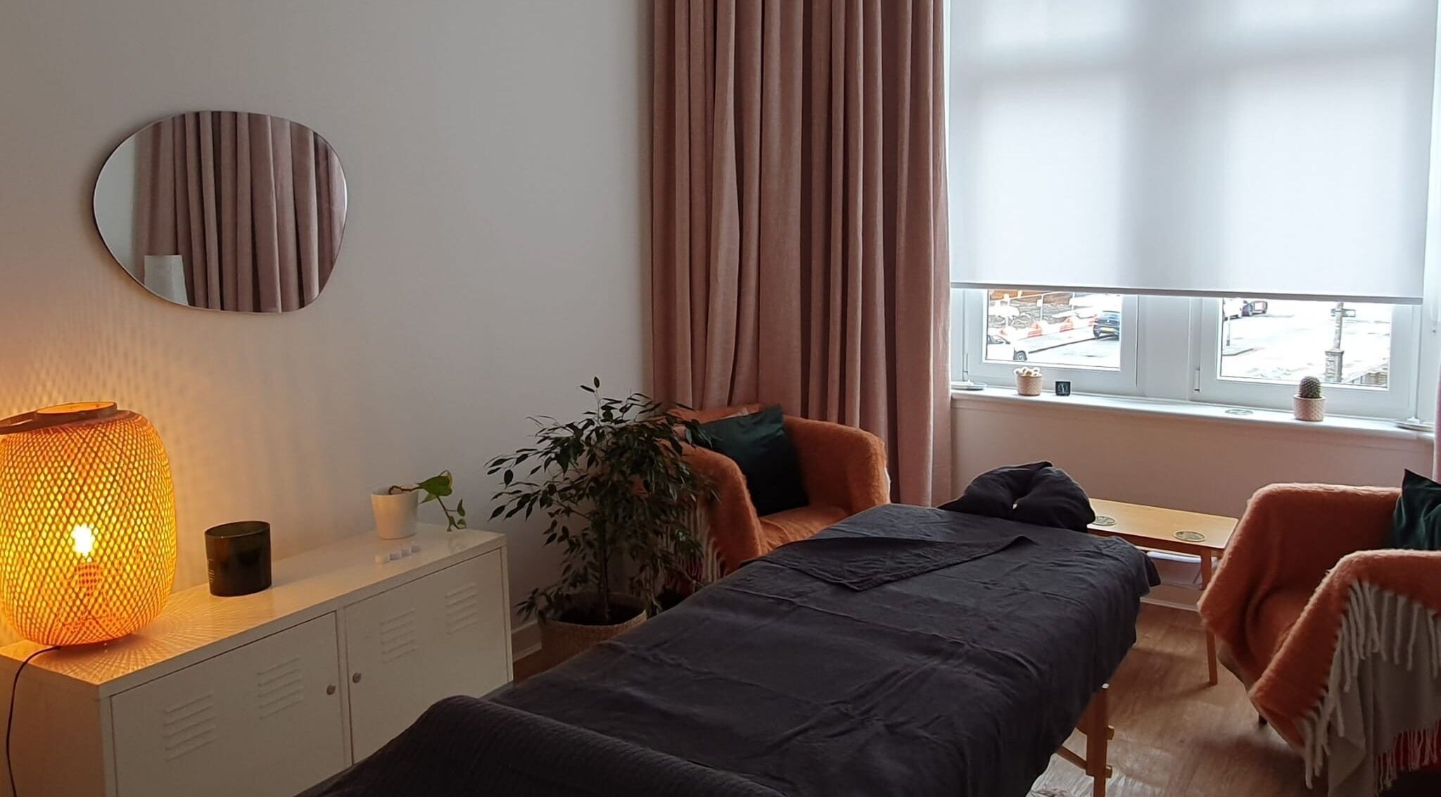 Tranquil massage room at Purl Massage Therapy Southside, Glasgow, Scotland, GB, featuring calming decor.
