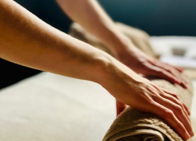 Therapist prepares massage bed at Purl Massage Therapy Southside, Glasgow, Scotland, GB.