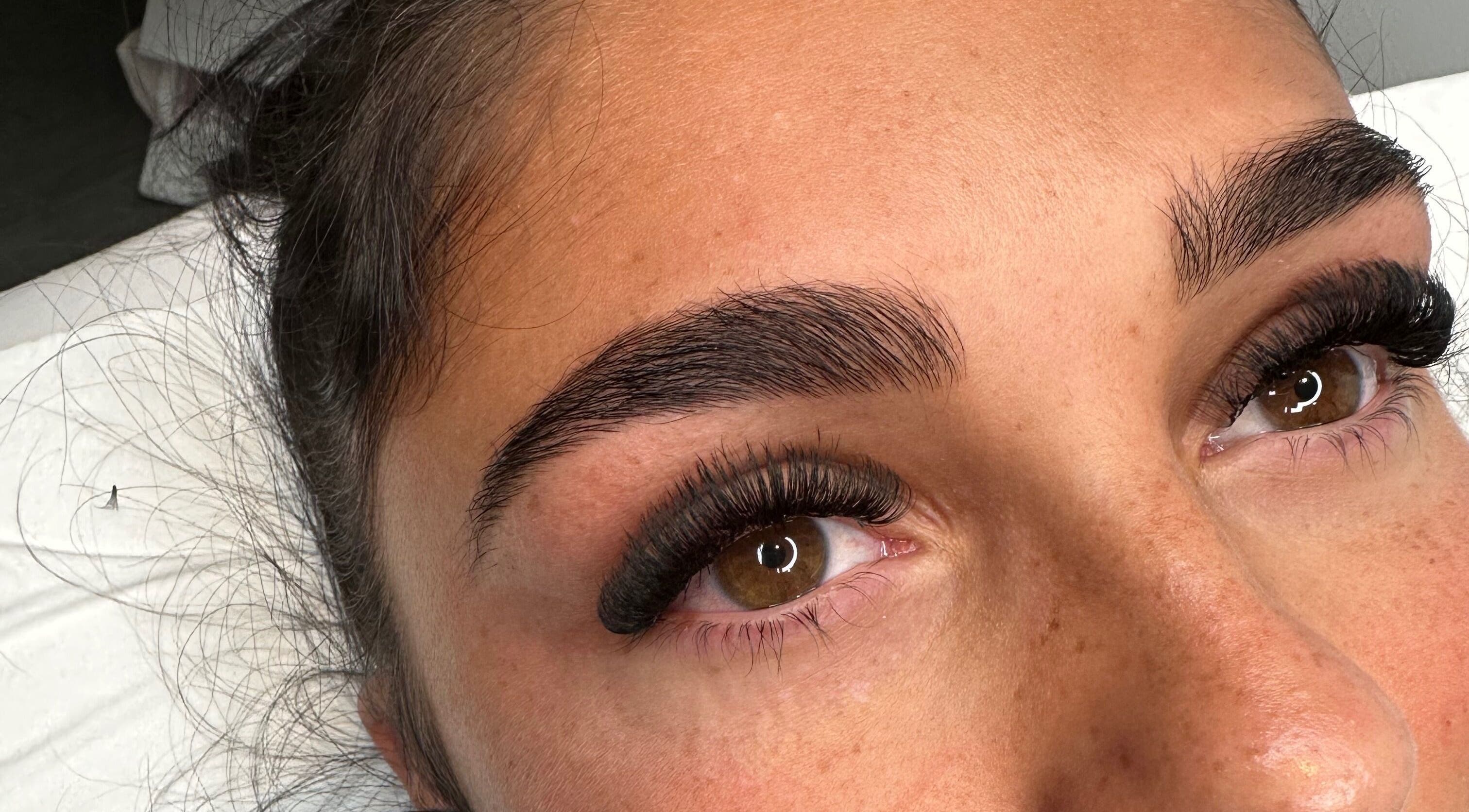 Beautiful eyelash extensions at Lashes by Olivia Niamh in Dartford, England, GB. Perfectly groomed brows complement the look.