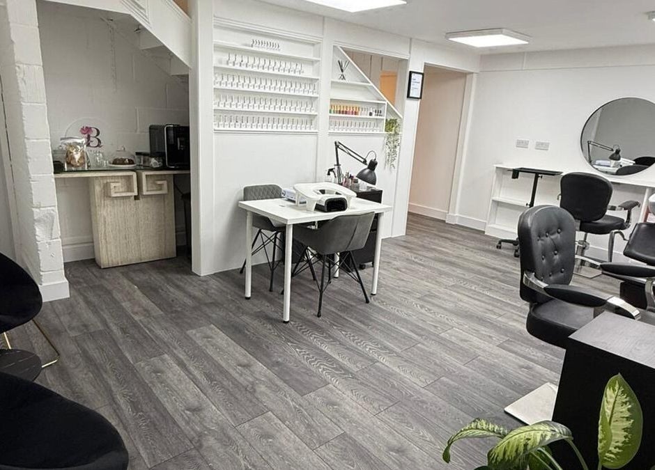 Interior of Bonita Aesthetics and Beauty, Braintree, England, GB showcasing chic salon chairs and nail stations.