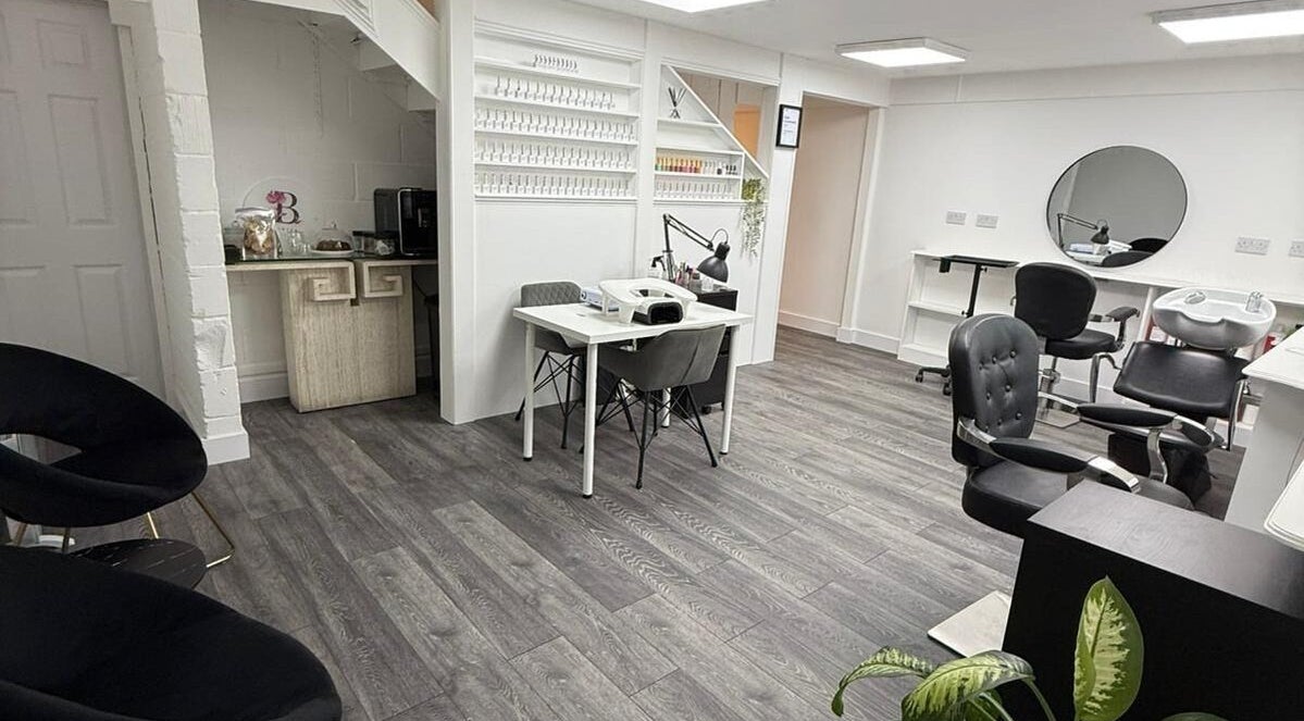 Interior of Bonita Aesthetics and Beauty, Braintree, England, GB showcasing chic salon chairs and nail stations.