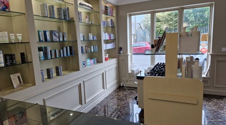 Kudos Beauty (Calla Lily) in Kildare, County Kildare, IE displays a variety of skincare products on elegant shelves.