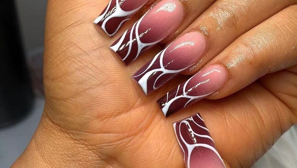Stylish maroon and white nail art by Nails by Ryan, Jos, Plateau, NG, showcasing intricate design.