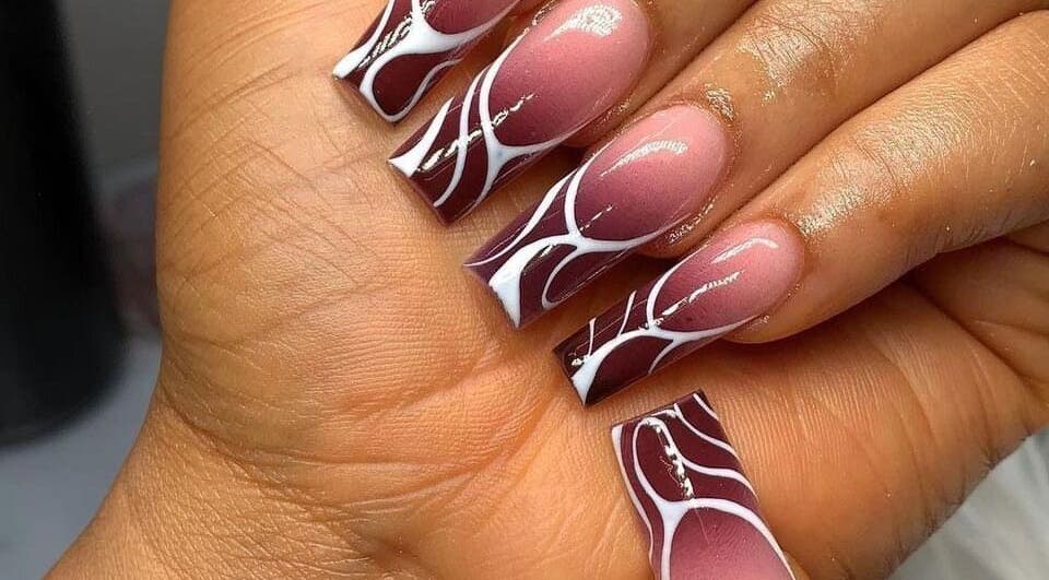 Stylish maroon and white nail art by Nails by Ryan, Jos, Plateau, NG, showcasing intricate design.