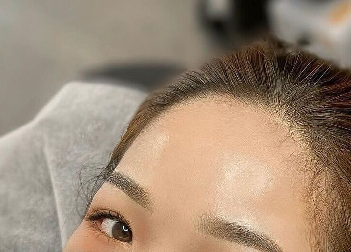 Close-up of a serene woman's face receiving a lash treatment at Md.Beautylash, Jawa Barat, Jawa Barat, ID.