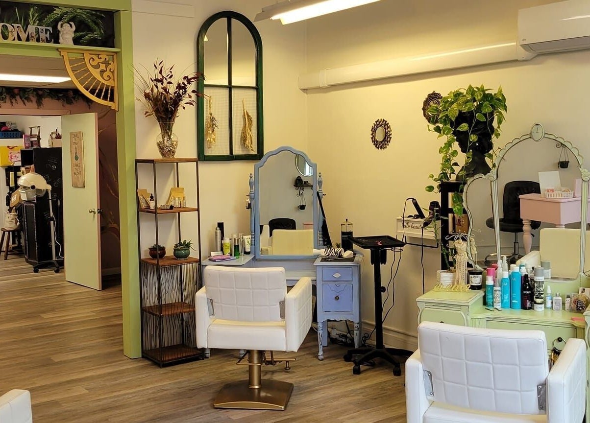 Interior of Practically Magic salon in South Glens Falls, New York, US, featuring elegant styling stations.