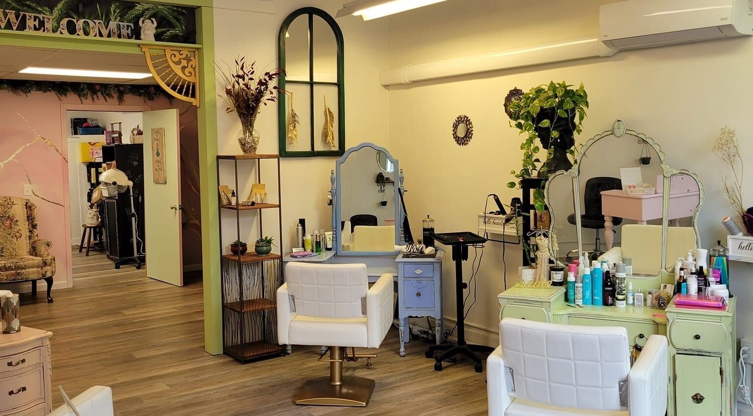 Interior of Practically Magic salon in South Glens Falls, New York, US, featuring elegant styling stations.