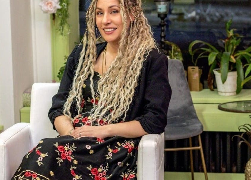 Welcoming interior of Practically Magic in South Glens Falls, New York, US, showcasing stylish seating and decor.