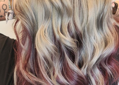 Vibrant wavy blonde and red hair styled at Serenity Hair Studio, Upper Hutt, Wellington, NZ.