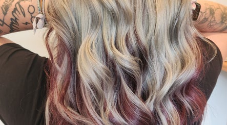 Vibrant wavy blonde and red hair styled at Serenity Hair Studio, Upper Hutt, Wellington, NZ.