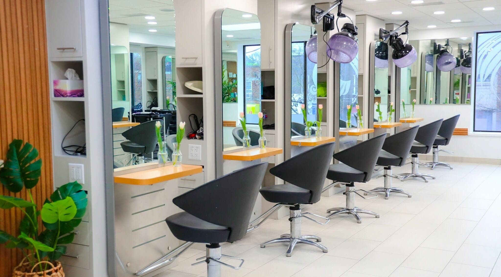 Modern salon interior at Olenza Beauty Loft in Toronto, Ontario, CA, featuring elegant styling stations.
