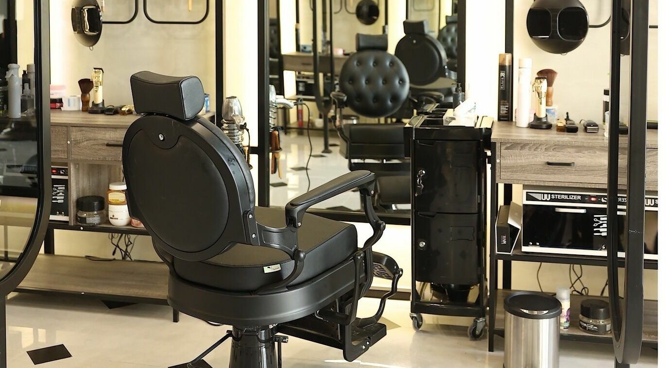 Modern barber chair at Mirror Barbershop, Riyadh, Riyadh Province, SA, showcasing sleek interior style.