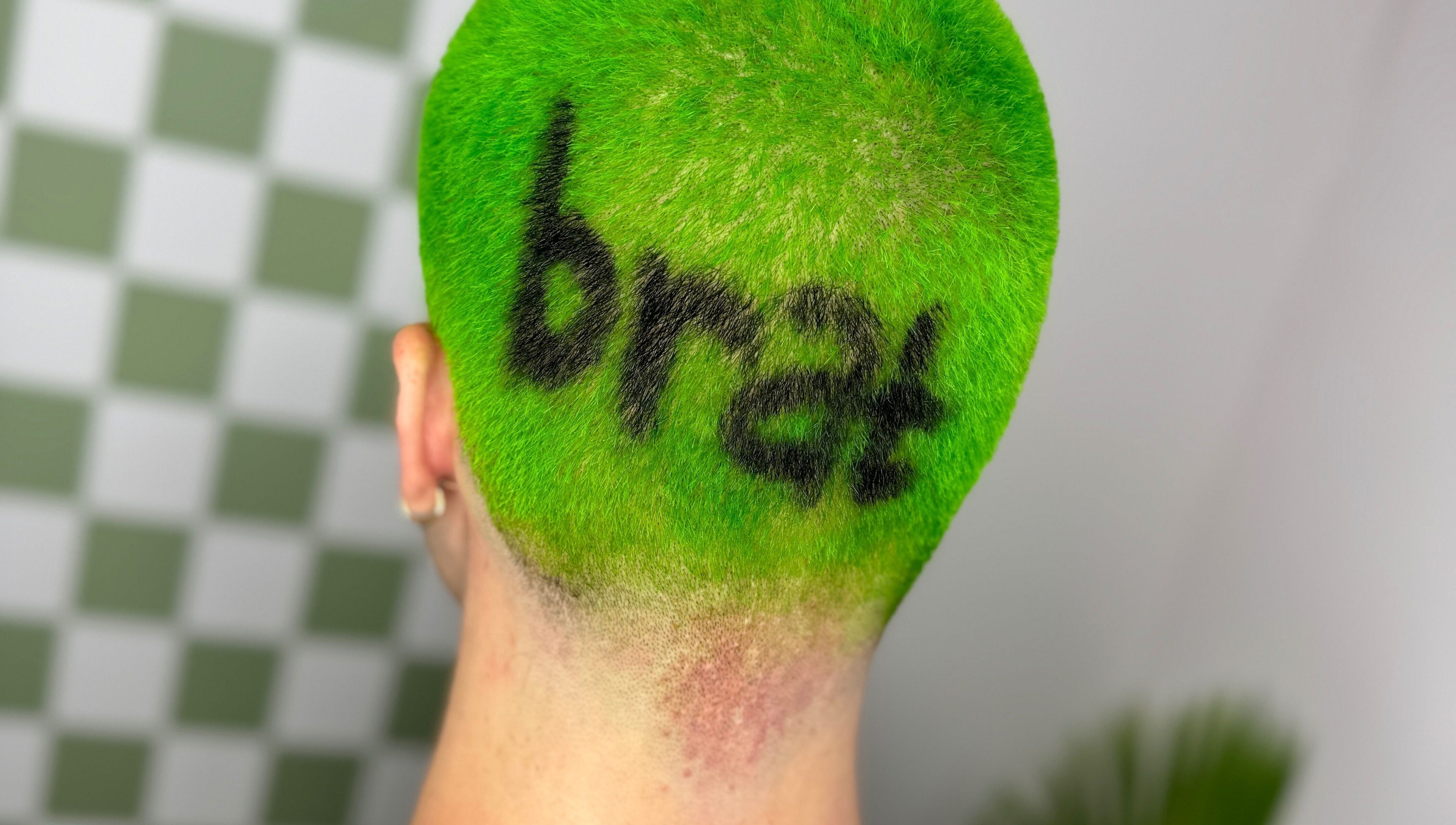 Bold neon green hair with artistic design at Hair Senpai, Campbelltown, New South Wales, AU.