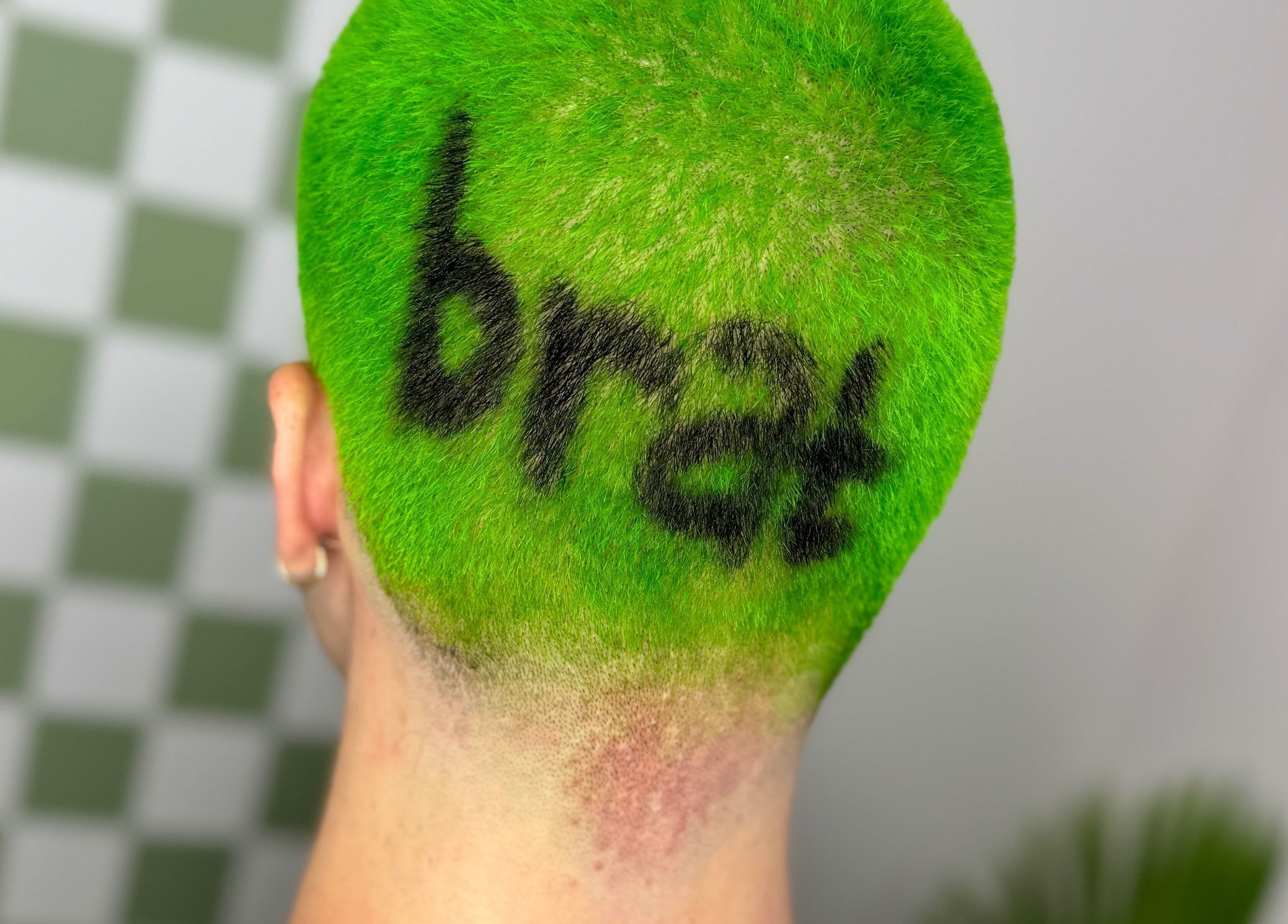 Bold neon green hair with artistic design at Hair Senpai, Campbelltown, New South Wales, AU.