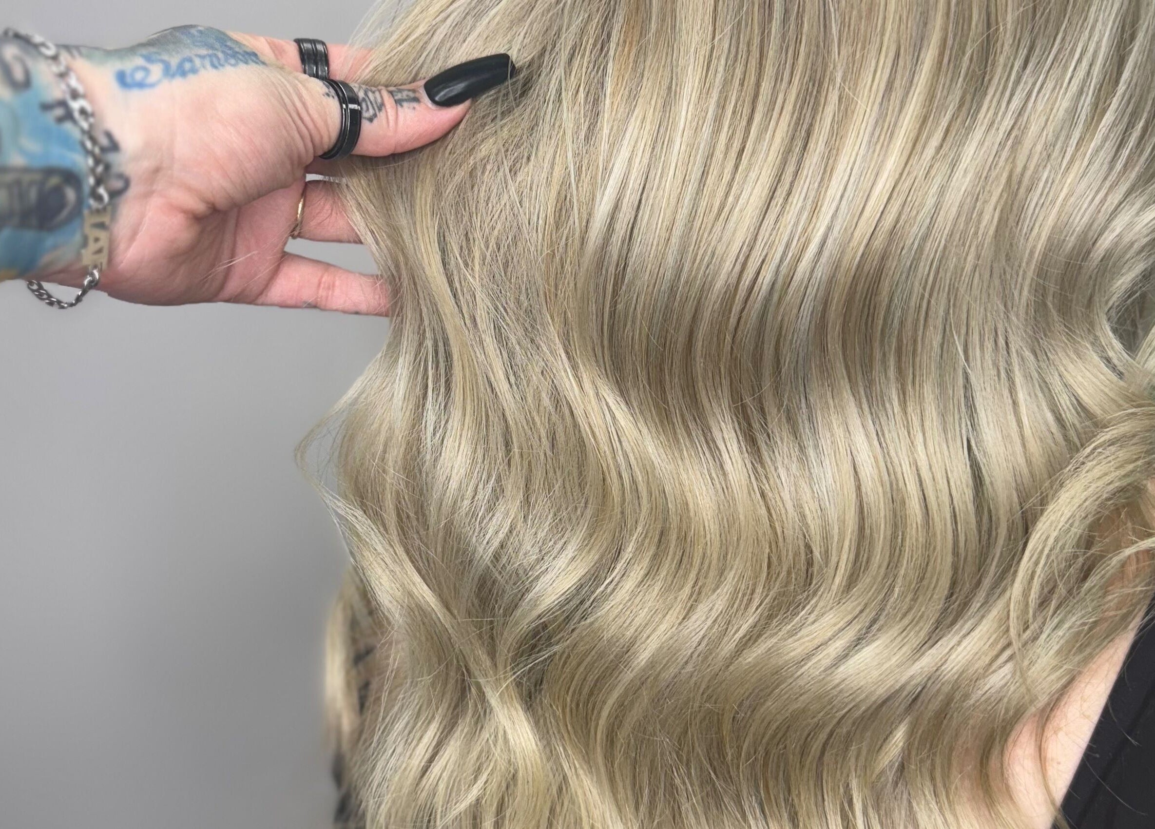 Stylish blonde waves expertly styled at Hair Senpai, Campbelltown, New South Wales, AU showcasing vibrant color.
