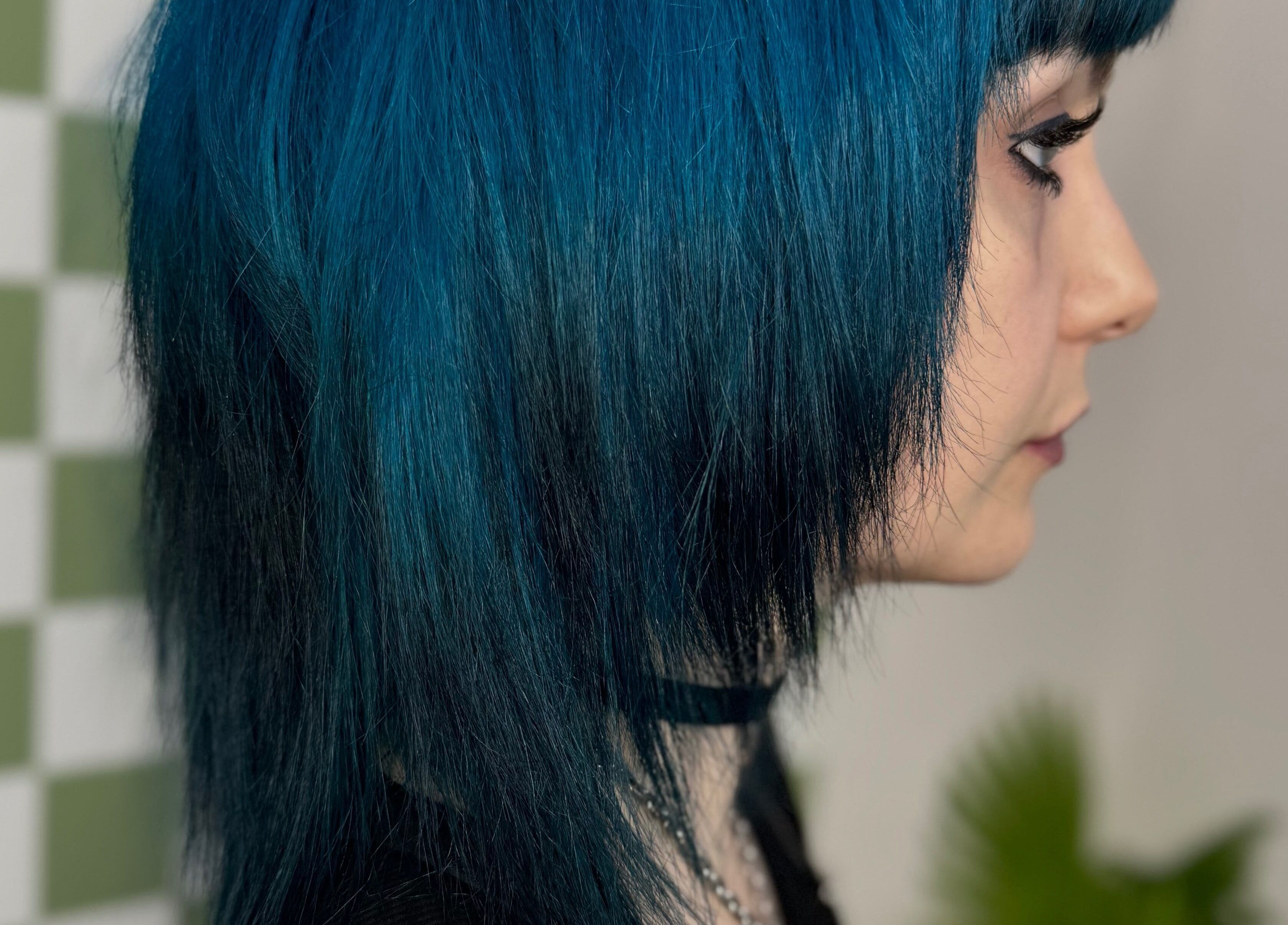 Profile view of blue-haired individual at Hair Senpai, Campbelltown, New South Wales, AU.