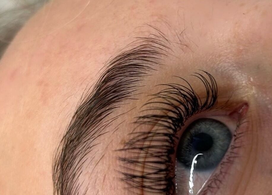 Close-up of expertly groomed eyebrows and lashes at Amour Esthetics LDN, London, Ontario, CA.