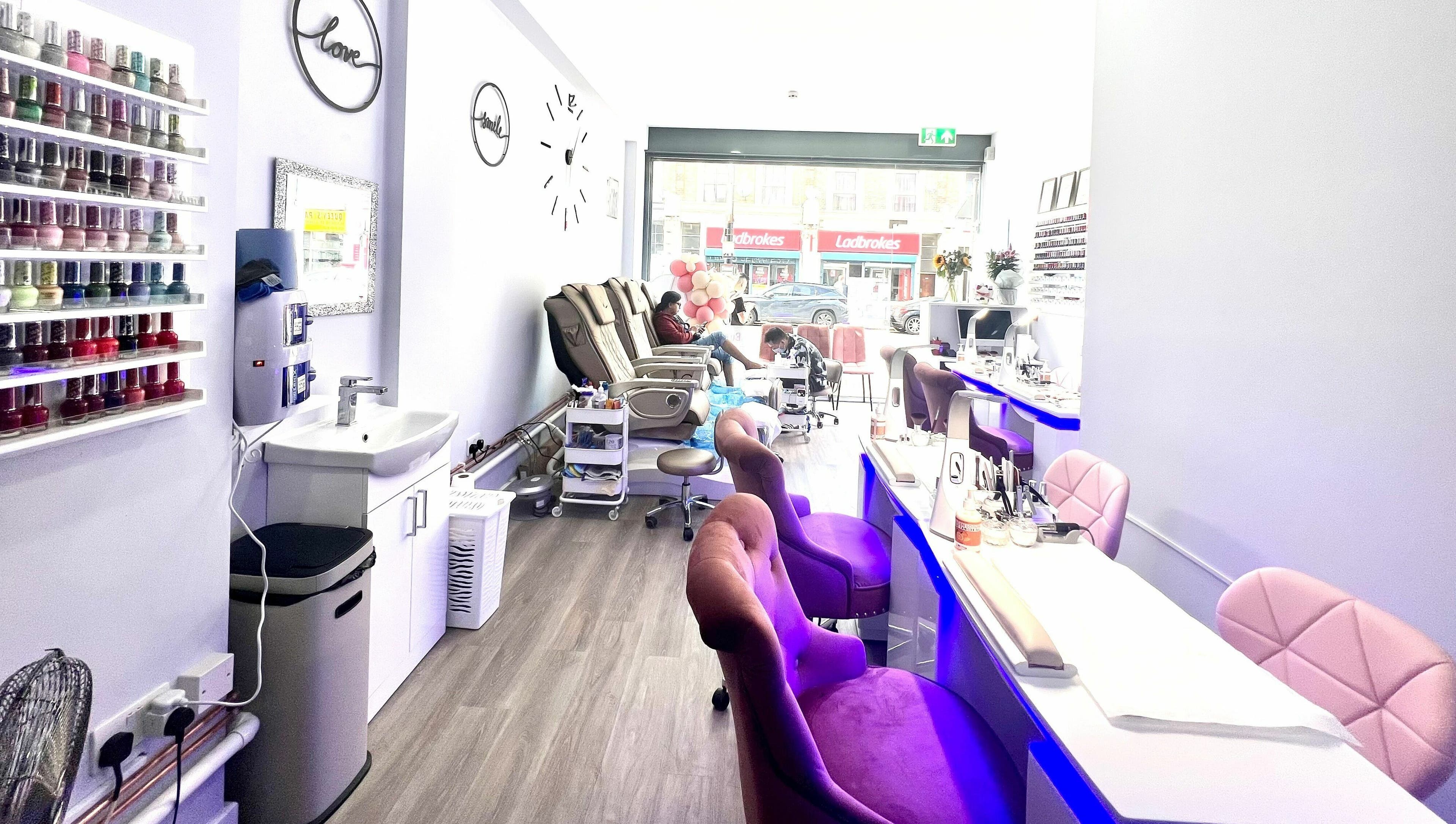 Interior of Q Nail Bar in London, England, GB with chic decor and comfortable seating for a relaxing manicure.