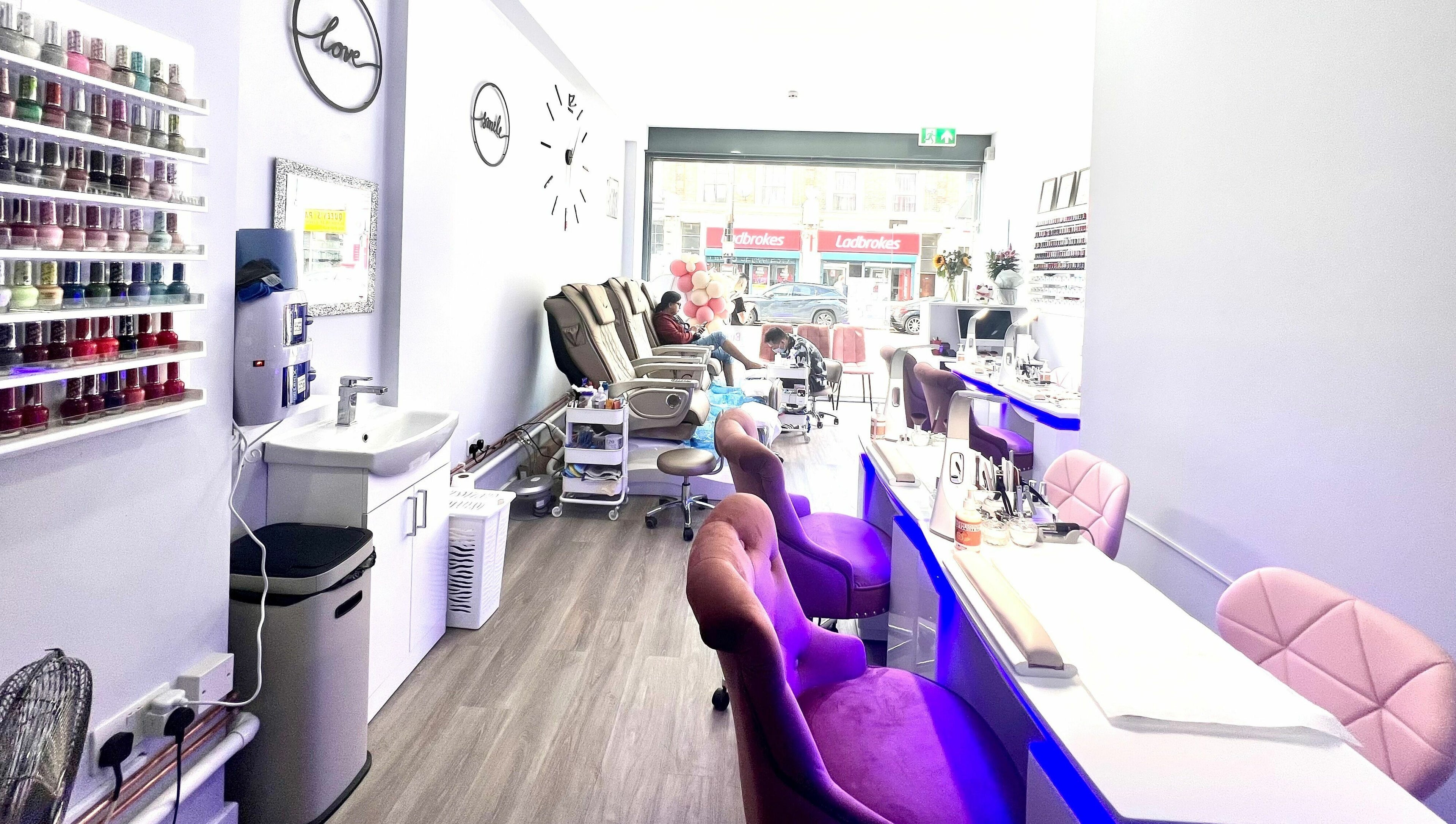 Interior of Q Nail Bar in London, England, GB with chic decor and comfortable seating for a relaxing manicure.
