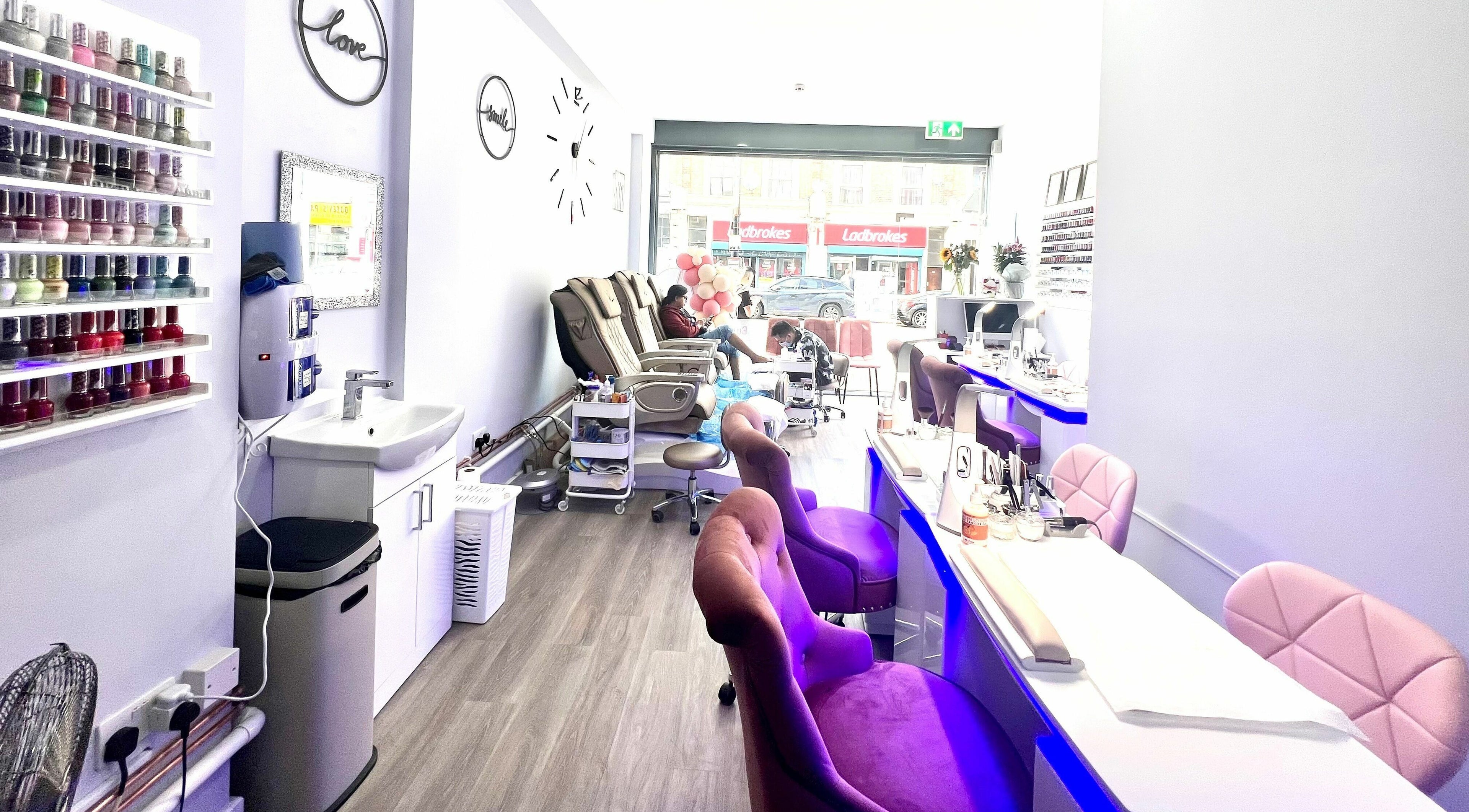 Interior of Q Nail Bar in London, England, GB with chic decor and comfortable seating for a relaxing manicure.