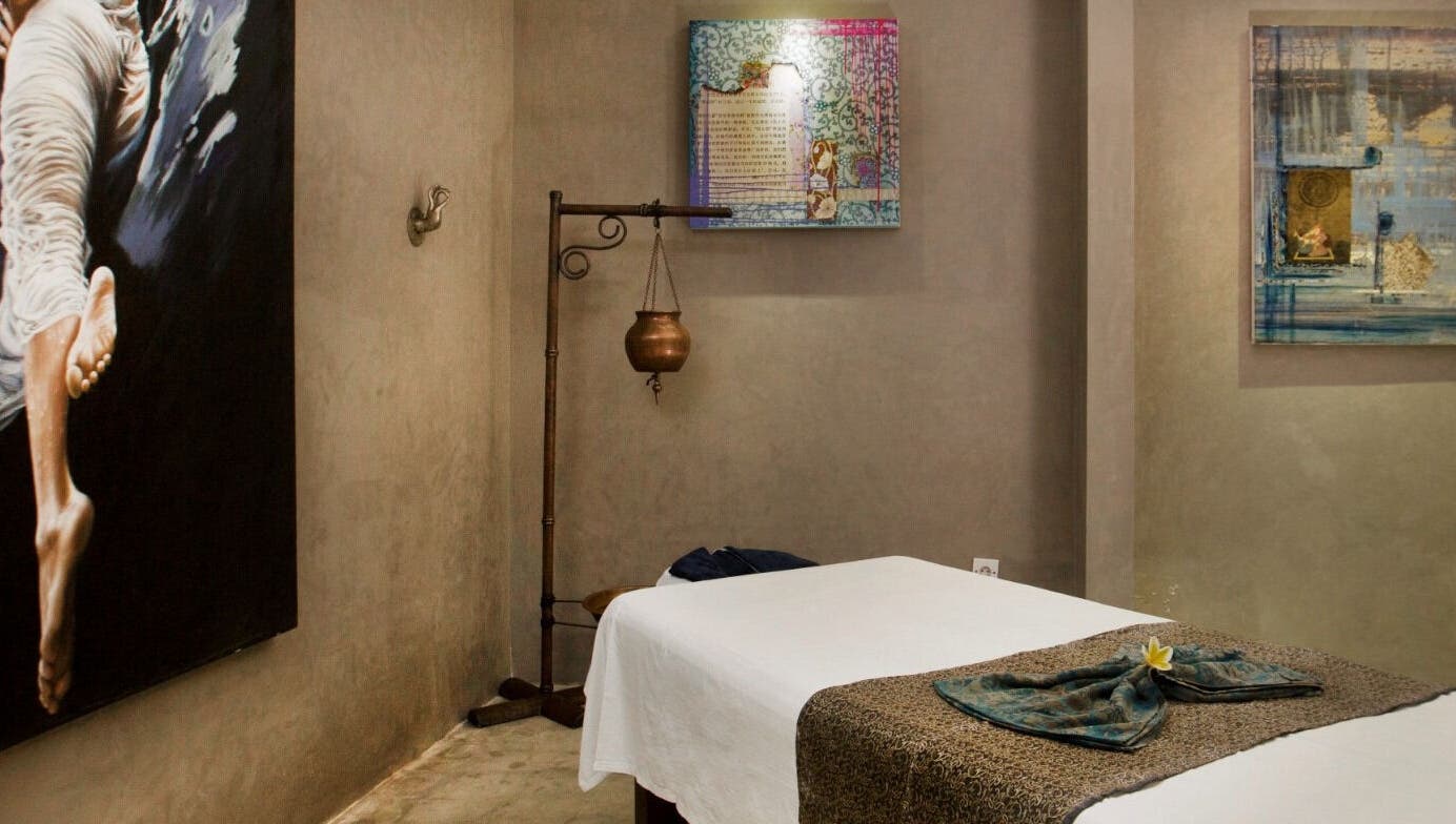 Serene massage room at Mudara Spa, Bali, Bali, ID with calming decor and treatment bed.