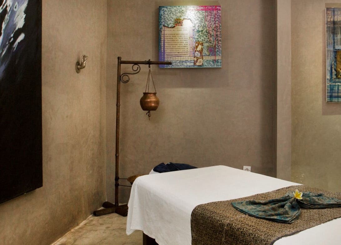 Serene massage room at Mudara Spa, Bali, Bali, ID with calming decor and treatment bed.