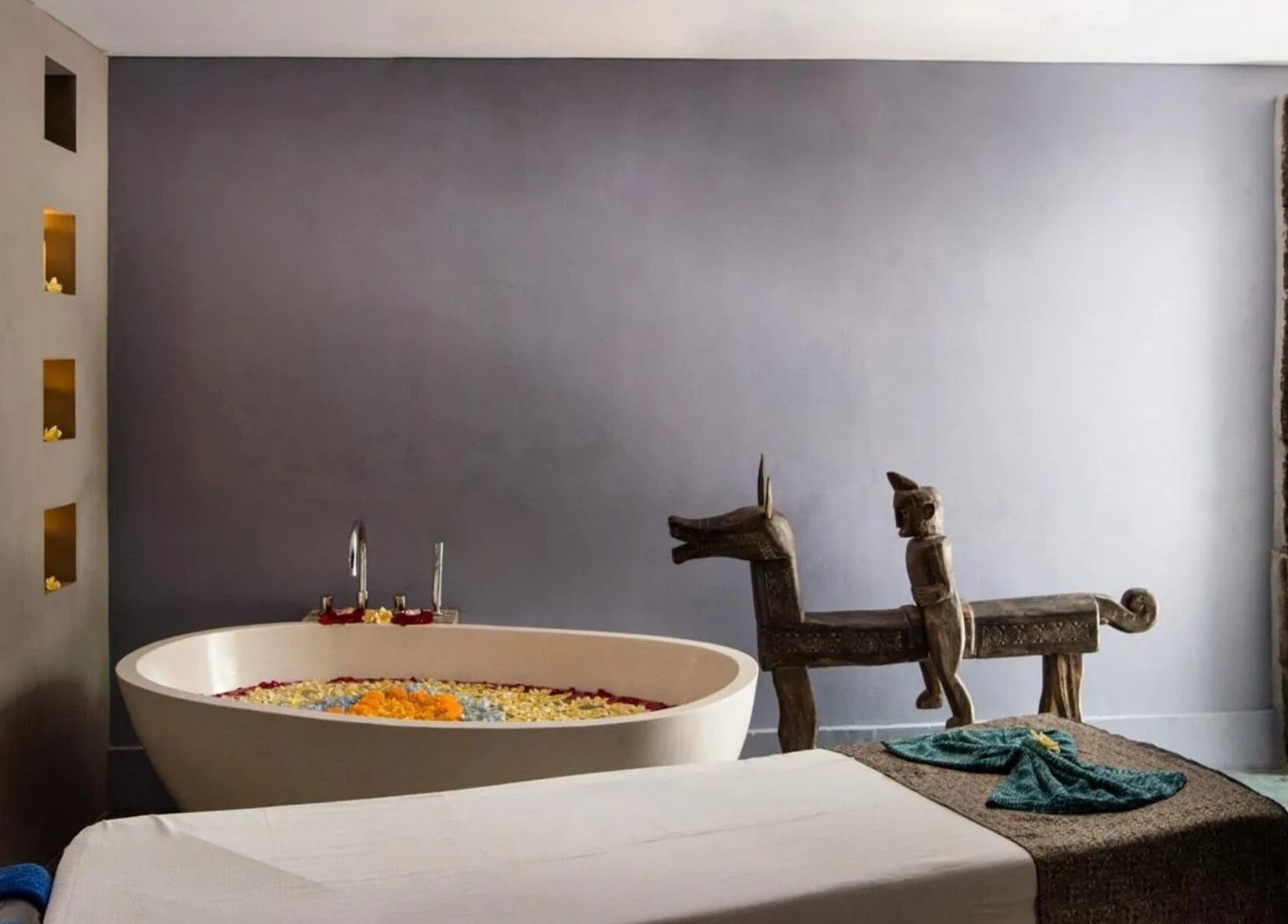 Luxury spa room with soaking tub at Mudara Spa, Bali, Bali, ID. Elegant design promotes ultimate relaxation.