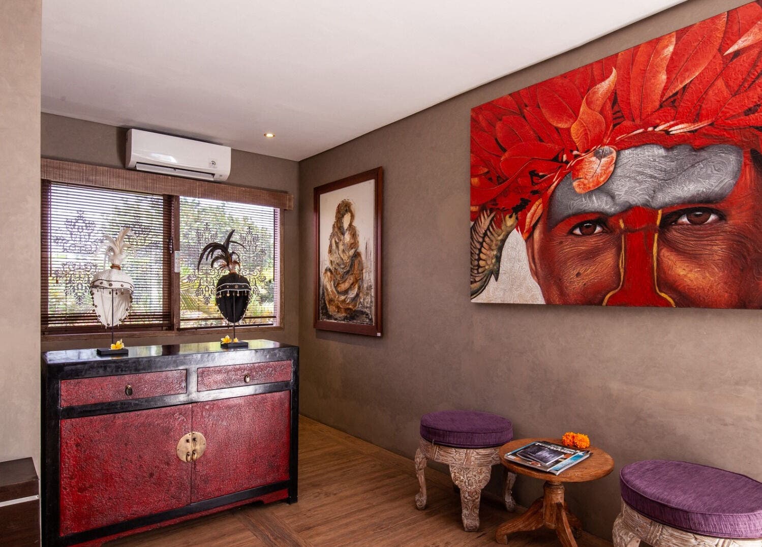 Mudara Spa lobby in Bali, Bali, ID featuring colorful tribal artwork and cozy seating.