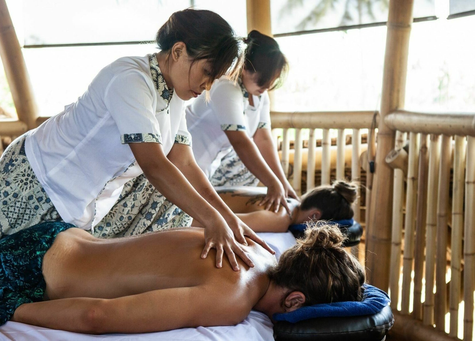 Therapists provide relaxing massages at Flying Bamboo Spa, Bali, Bali, ID. Experience ultimate relaxation.