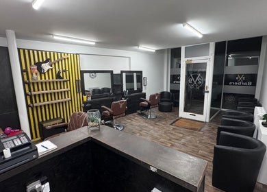 Chic interior of V29 Barbershop in Burton Upon Trent, England, GB featuring modern furnishings and décor.